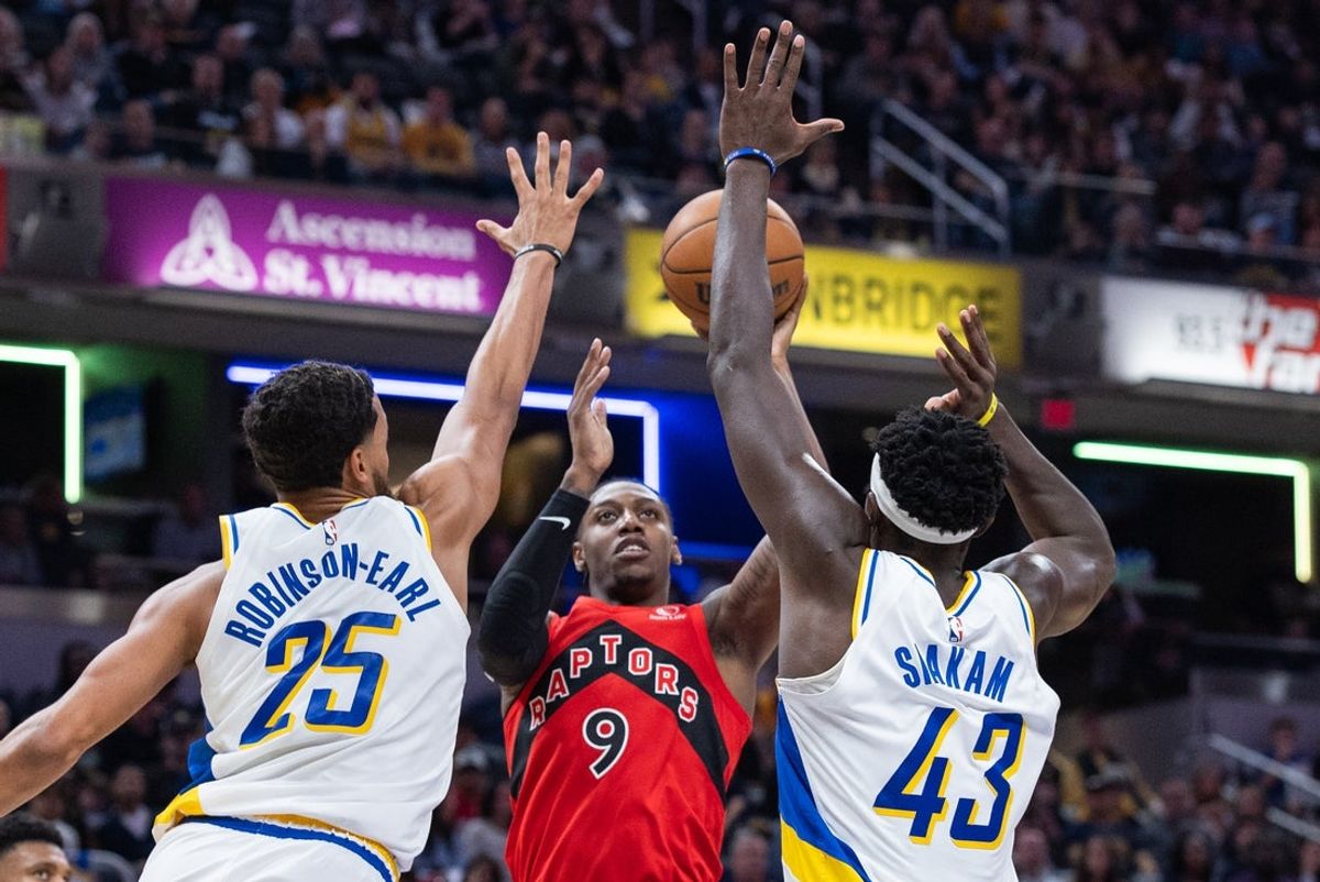 Nov 15, 2025; Indianapolis, Indiana, USA;  Toronto Raptors forward/guard RJ Barrett (9) shoots the ball while Indiana Pacers forward Jeremiah Robinson-Earl (25) and forward Pascal Siakam (43) defend in the first half at Gainbridge Fieldhouse. Mandatory Credit: Trevor Ruszkowski-Imagn Images