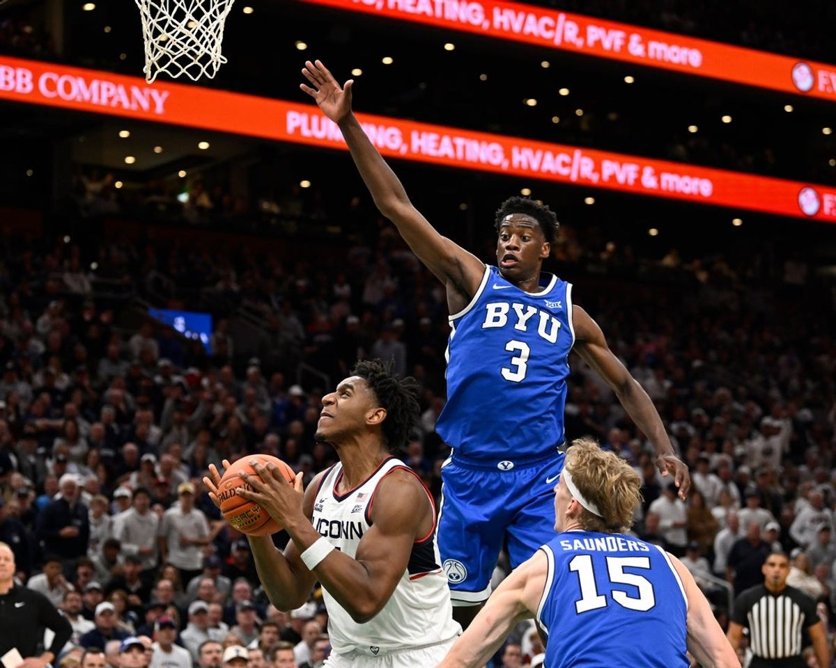 Nov 15, 2025; Boston, Massachusetts, USA; BYU Cougars forward AJ Dybantsa (3) defends against UConn Huskies forward Tarris Reed Jr. (5) during the first half at TD Garden. Mandatory Credit: Eric Canha-Imagn Images
