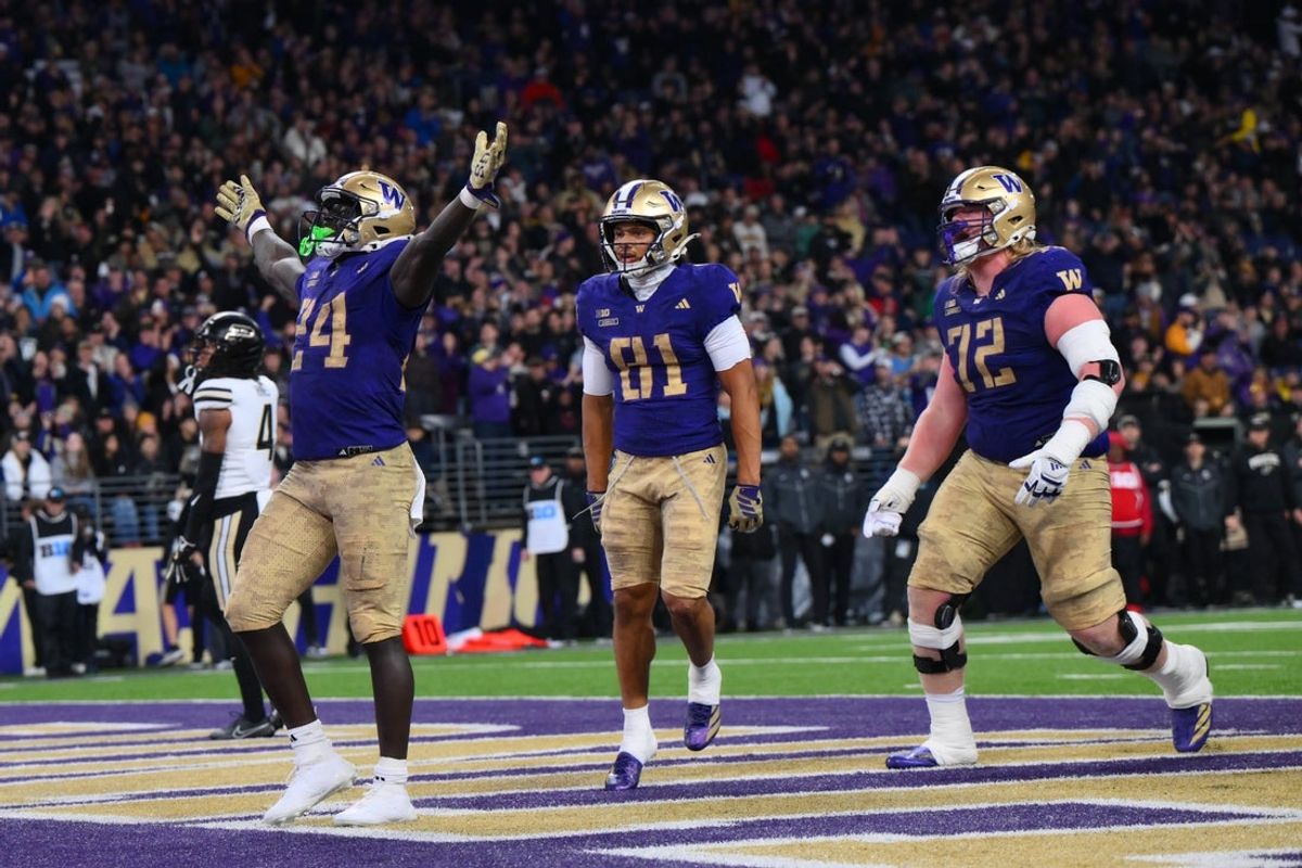 Nov 15, 2025; Seattle, Washington, USA; Washington Huskies running back Adam Mohammed (24) celebrates after scoring a touchdown against the Purdue Boilermakers during the first half at Husky Stadium. Mandatory Credit: Steven Bisig-Imagn Images