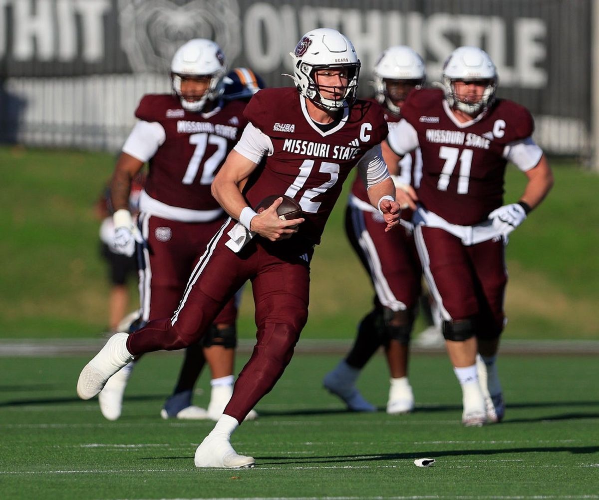 Missouri State quarterback Jacob Clark (12) carries the ball during the homecoming football game against UTEP on Saturday, Nov. 15, 2025.