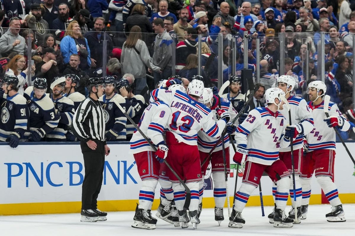 Nov 15, 2025; Columbus, Ohio, USA;  New York Rangers center J.T. Miller (8) celebrates with teammates after defeating the Columbus Blue Jackets in a shootout at Nationwide Arena. Mandatory Credit: Aaron Doster-Imagn Images
