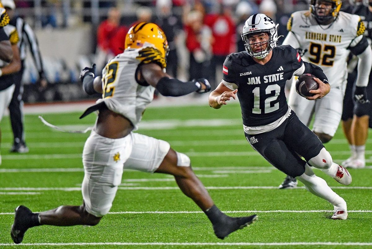 Jax State's Caden Creel tries to evade the tackle of Kennesaw State's Kody Jones during college school football action at AmFirst Stadium in Jacksonville, Alabama November 15, 2025. (Dave Hyatt / Hyatt Media LLC)