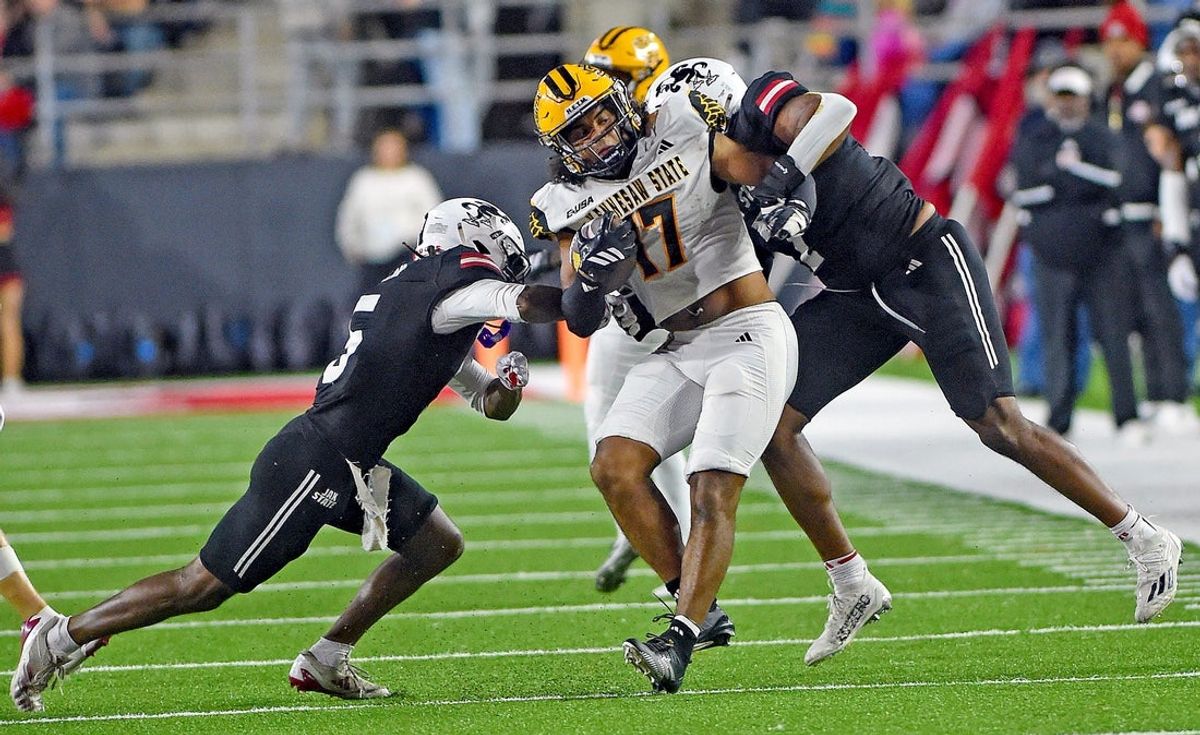 Kennesaw State's Gerard Bullock Jr. tries to evade the tackle of Jax State's Tyrin Taylor and Isaac Walker during college school football action at AmFirst Stadium in Jacksonville, Alabama November 15, 2025. (Dave Hyatt / Hyatt Media LLC)