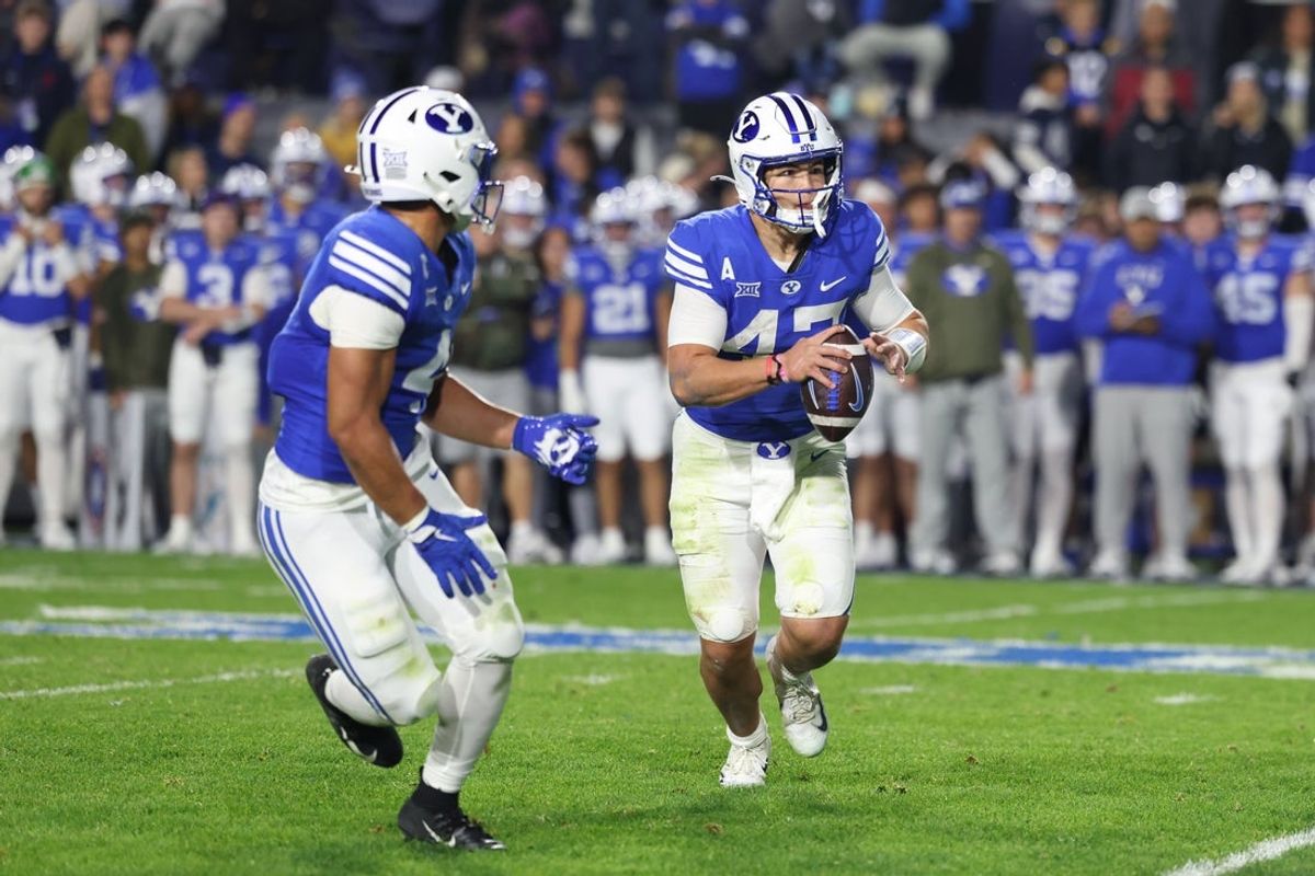 Nov 15, 2025; Provo, Utah, USA; BYU Cougars quarterback Bear Bachmeier (47) plays a run pass option against the Texas Christian University Horned Frogs during the first half at LaVell Edwards Stadium. Mandatory Credit: Rob Gray-Imagn Images