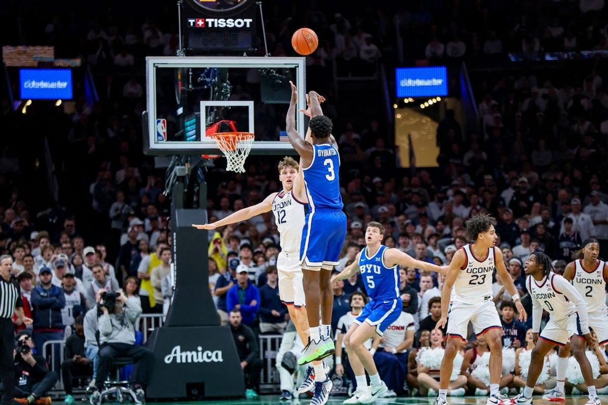 BYU's AJ Dybantsa fires a jump shot over UConn's Eric Reibe during a game at TD Garden in Boston, Massachusetts on Saturday, Nov. 15, 2025.