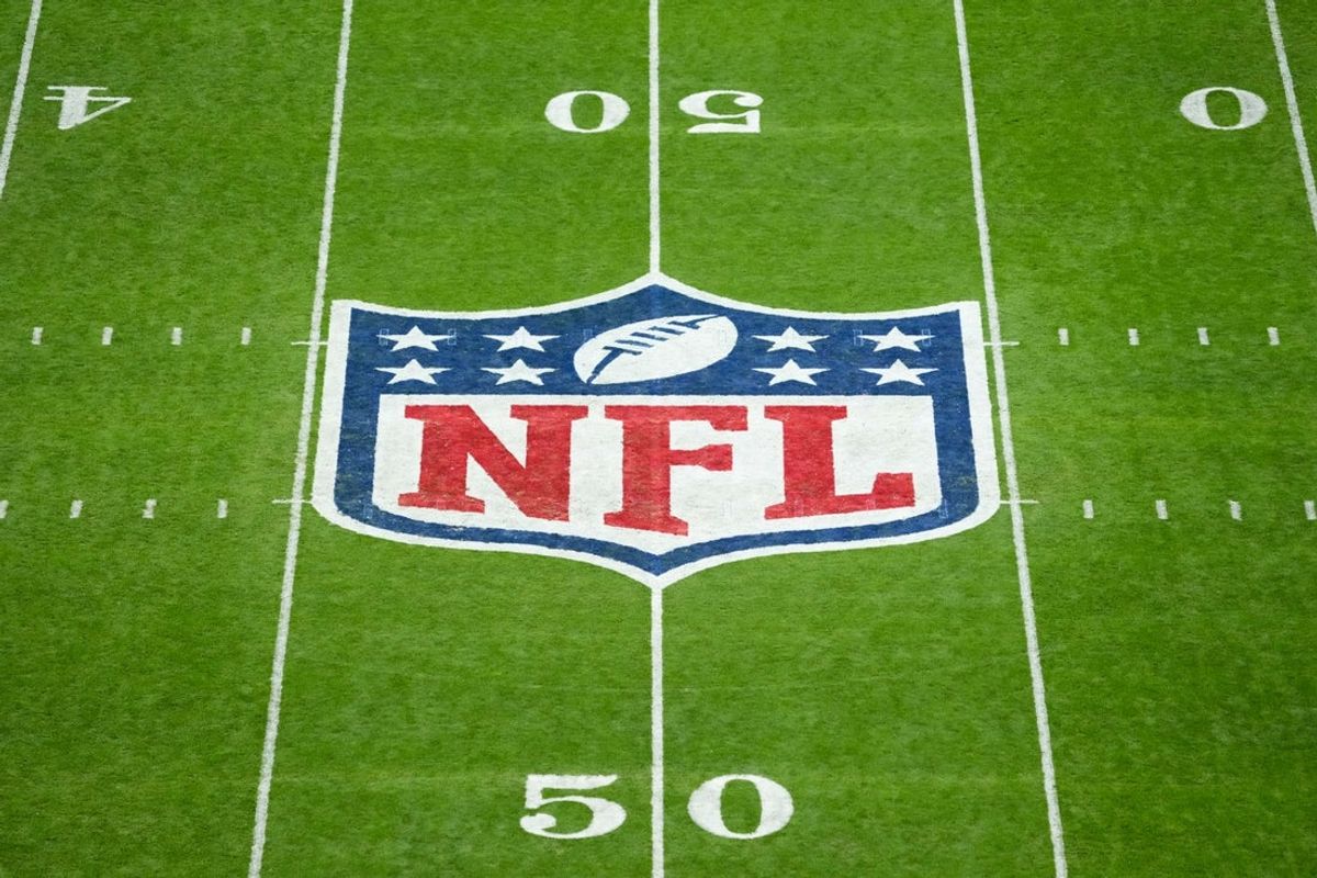 Nov 16, 2025; Madrid, Spain; The NFL logo at midfield is seen prior to the 2025 NFL Madrid Game between the Miami Dolphins and the Washington Commanders at Santiago Bernabeu Stadium. Mandatory Credit: Kirby Lee-Imagn Images