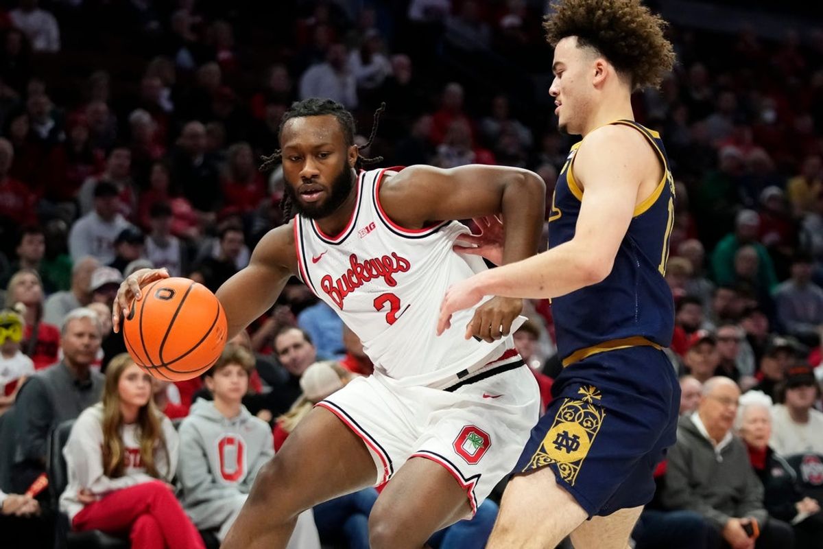 Ohio State Buckeyes guard Bruce Thornton (2) dribbles around Notre Dame Fighting Irish guard Braeden Shrewsberry (11) during the first half of the men's NCAA basketball game at Value City Arena in Columbus on Nov. 16, 2025.