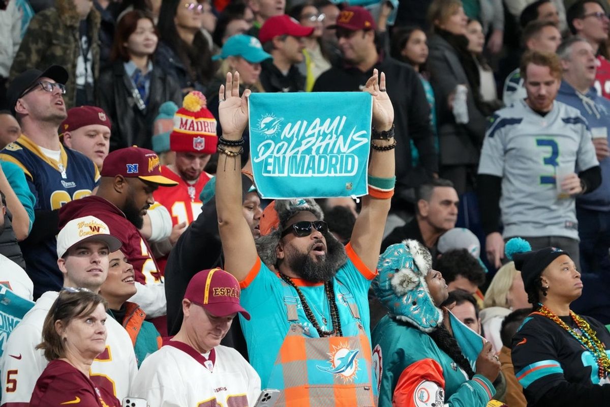 Nov 16, 2025; Madrid, Spain; Fans watch action between the Miami Dolphins and the Washington Commanders in the fourth quarter during the 2025 NFL Madrid Game at Santiago Bernabeu Stadium. Mandatory Credit: Kirby Lee-Imagn Images