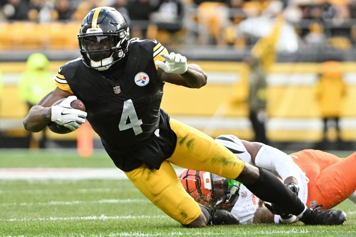 Nov 16, 2025; Pittsburgh, Pennsylvania, USA; Cincinnati Bengals safety Jordan Battle (27) tackles Pittsburgh Steelers wide receiver DK Metcalf (4) during the second half at Acrisure Stadium. Mandatory Credit: Barry Reeger-Imagn Images