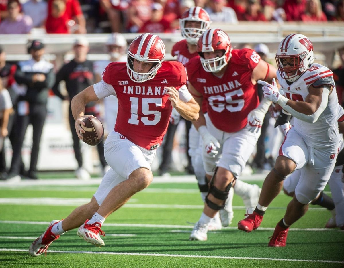 Indiana's Fernando Mendoza (15) runs during the Indiana versus Wisconsin football game at Memorial Stadium on Saturday, Nov. 15, 2025.