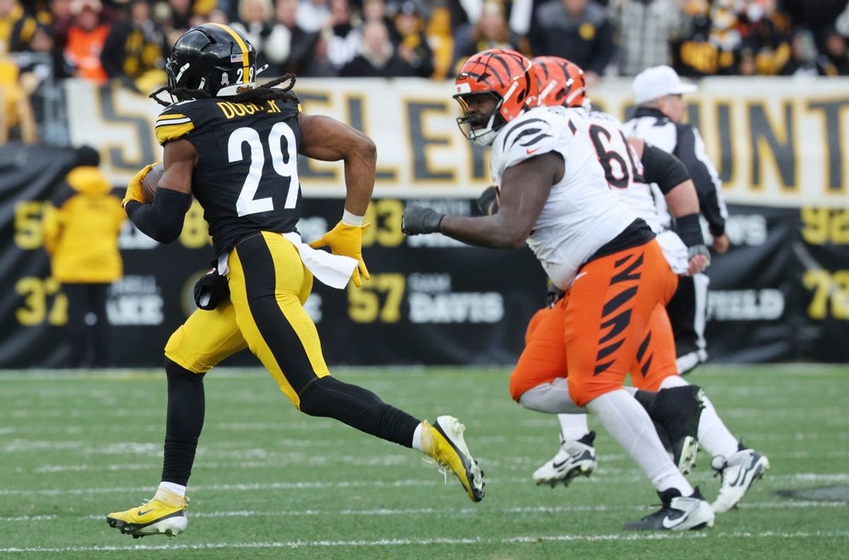 Nov 16, 2025; Pittsburgh, Pennsylvania, USA; Pittsburgh Steelers safety Kyle Dugger (29) intercepts the ball against the Cincinnati Bengals during the second half at Acrisure Stadium. Mandatory Credit: Charles LeClaire-Imagn Images