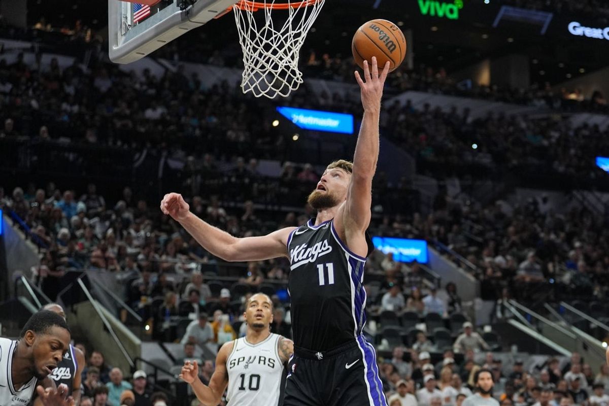 Nov 16, 2025; San Antonio, Texas, USA; Sacramento Kings forward Domantas Sabonis (11) shoots in the second half against the San Antonio Spurs at Frost Bank Center. Mandatory Credit: Daniel Dunn-Imagn Images