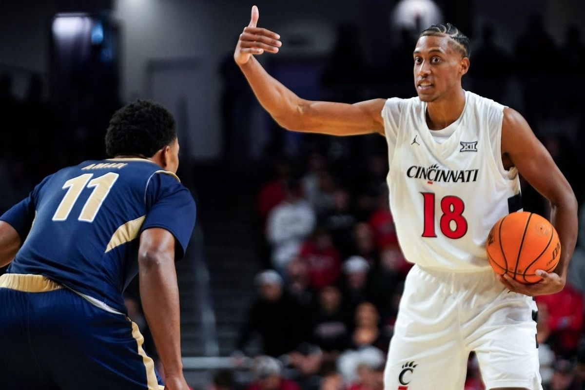 Cincinnati Bearcats forward Baba Miller (18) signals to a teammate in the first half of a NCAA men’s basketball game between the Cincinnati Bearcats and Mount St. Mary’s Mountaineers, Sunday, Nov. 16, 2025, at Fifth Third Arena in Cincinnati.