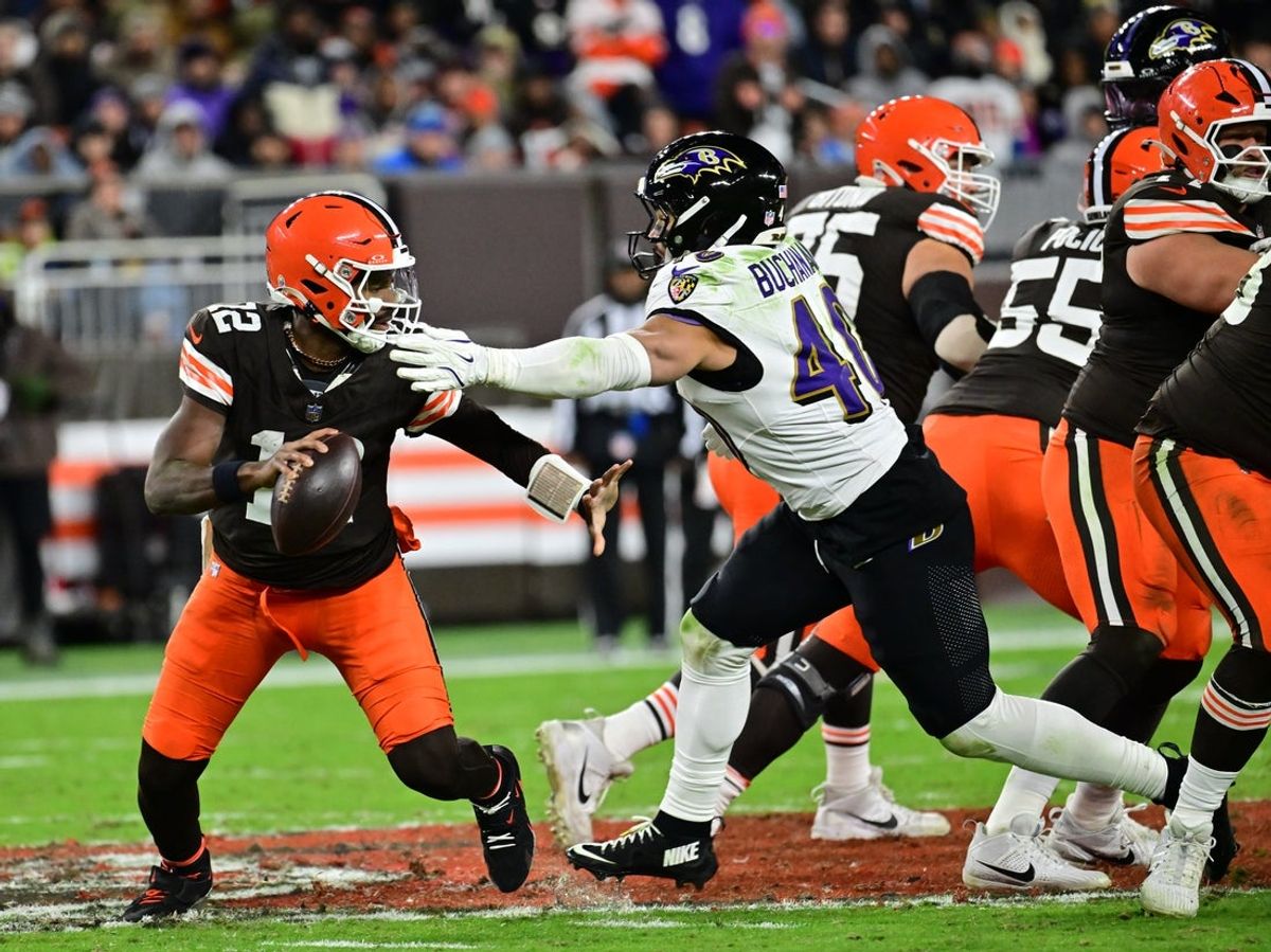 Nov 16, 2025; Cleveland, Ohio, USA; Cleveland Browns quarterback Shedeur Sanders (12) is sacked by Baltimore Ravens linebacker Teddye Buchanan (40) during the fourth quarter at Huntington Bank Field. Mandatory Credit: Ken Blaze-Imagn Images