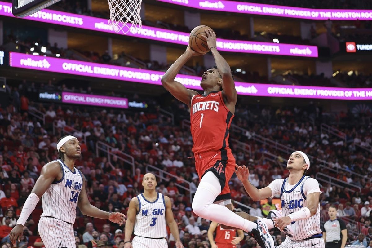 Nov 16, 2025; Houston, Texas, USA; Houston Rockets guard Amen Thompson (1) drives to the basket during the second quarter against the Orlando Magic at Toyota Center. Mandatory Credit: Troy Taormina-Imagn Images