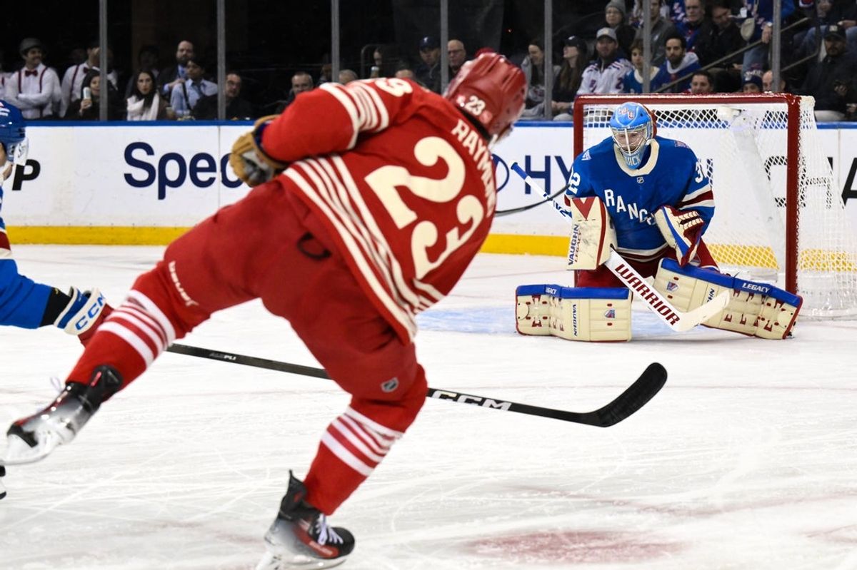 Nov 16, 2025; New York, New York, USA; New York Rangers goaltender Jonathan Quick (32) makes a save against Detroit Red Wings left wing Lucas Raymond (23) during the second period at Madison Square Garden. Mandatory Credit: John Jones-Imagn Images