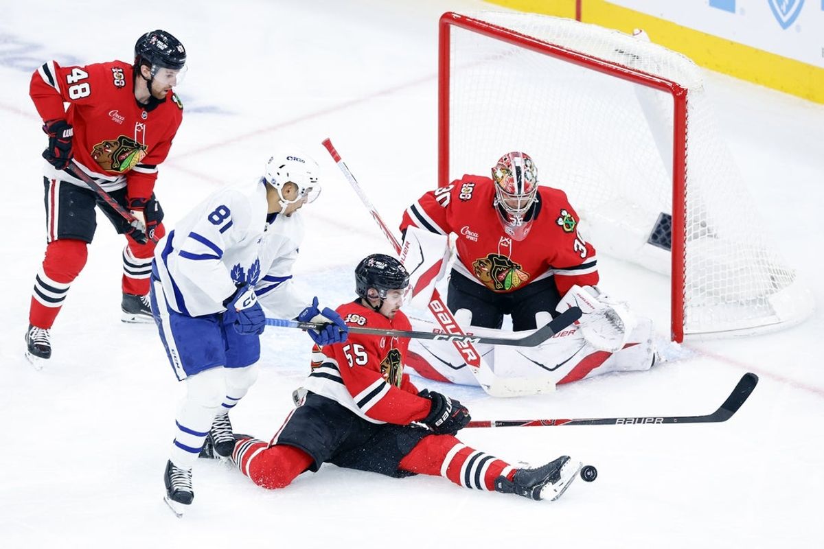 Nov 15, 2025; Chicago, Illinois, USA; Chicago Blackhawks defenseman Artyom Levshunov (55) defends against Toronto Maple Leafs center Dakota Joshua (81) during the third period at United Center. Mandatory Credit: Kamil Krzaczynski-Imagn Images