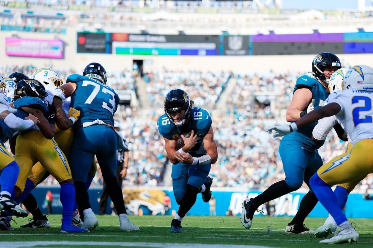 Jacksonville Jaguars quarterback Trevor Lawrence (16) scores a touchdown during the third quarter of an NFL football game at EverBank Stadium, Sunday, Nov. 16, 2025 in Jacksonville, Fla. The Jacksonville Jaguars defeated the Los Angeles Chargers 35-6. [Corey Perrine/Florida Times-Union]