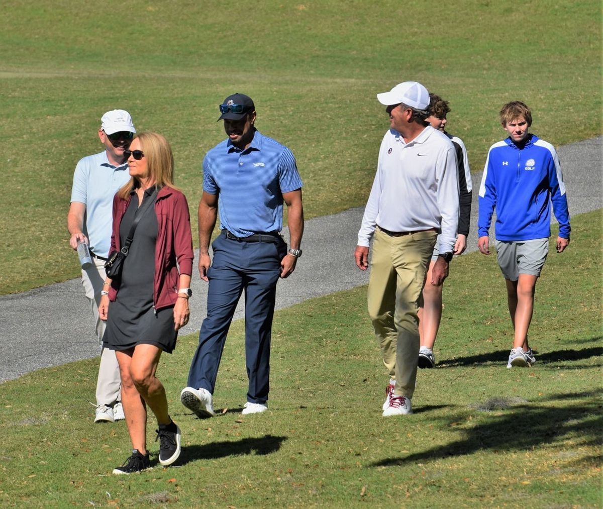 Tiger Woods walks alongside Florida State golf head coach Trey Jones as they watch Charlie Woods compete at the Class 1A state championship on Nov. 15, 2025.