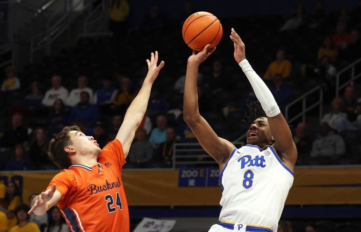 Nov 17, 2025; Pittsburgh, Pennsylvania, USA;  Pittsburgh Panthers guard Omari Witherspoon (8) shoots against Bucknell Bison guard Achile Spadone (24) during the first half at the Petersen Events Center. Mandatory Credit: Charles LeClaire-Imagn Images