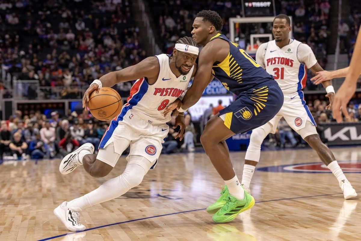 Nov 17, 2025; Detroit, Michigan, USA; Indiana Pacers guard Bennedict Mathurin (00) defends against Detroit Pistons guard Caris LeVert (8) during the first quarter at Little Caesars Arena. Mandatory Credit: David Reginek-Imagn Images