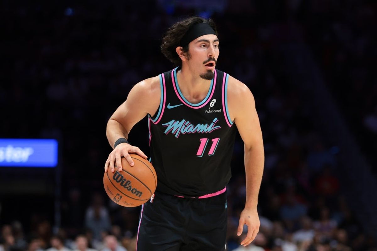 Nov 17, 2025; Miami, Florida, USA; Miami Heat forward Jaime Jaquez Jr. (11) dribbles the basketball against New York Knicks during the first quarter at Kaseya Center. Mandatory Credit: Sam Navarro-Imagn Images