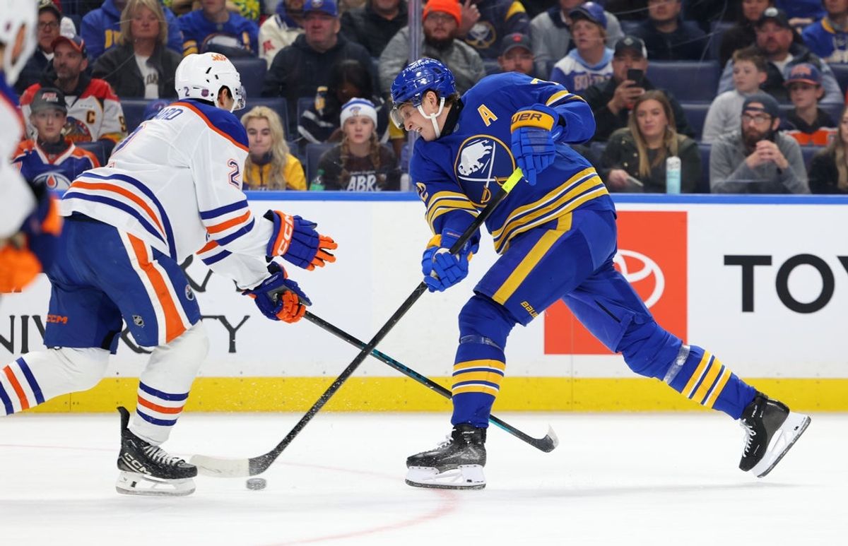 Nov 17, 2025; Buffalo, New York, USA;  Edmonton Oilers defenseman Evan Bouchard (2) tries to block a shot by Buffalo Sabres center Tage Thompson (72) during the second period at KeyBank Center. Mandatory Credit: Timothy T. Ludwig-Imagn Images