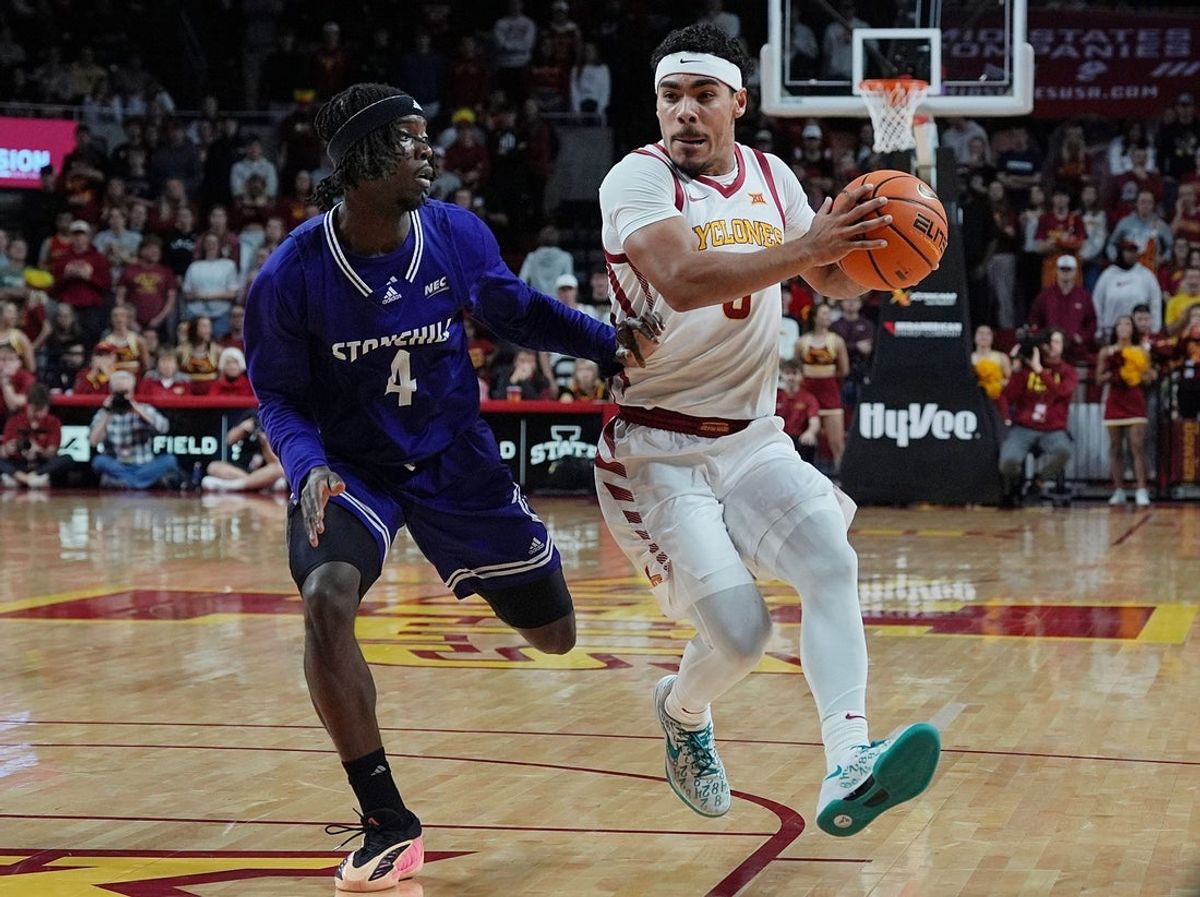 Iowa State Cyclones guard Tamin Lipsey (3) drives to the basket around Stonehill Skyhawks guard Davante Hackett (4) during the first half in the NCAA basketball on Nov. 17, 2025, at Hilton Coliseum in Ames, Iowa.Iowa.
