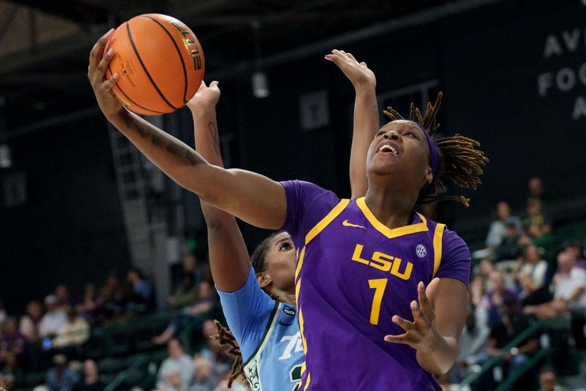Nov 17, 2025; New Orleans, Louisiana, USA; LSU Tigers forward Amiya Joyner (1) shoots against Tulane Green Wave forward Amira Mabry (23) during the second half at Avron B. Fogelman Arena in Devlin Fieldhouse. Mandatory Credit: Matthew Hinton-Imagn Images
