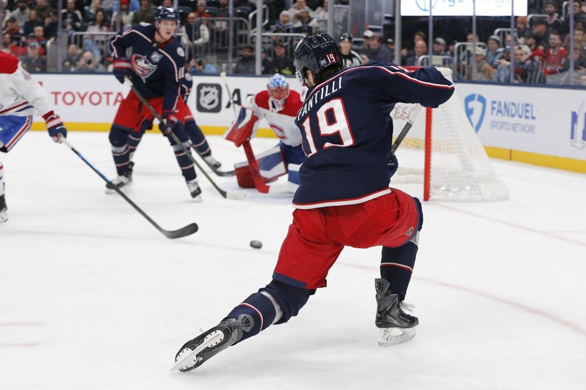 Nov 17, 2025; Columbus, Ohio, USA; Columbus Blue Jackets center Adam Fantilli (19) wrists a shot on goal against the Montreal Canadiens during the second period at Nationwide Arena. Mandatory Credit: Russell LaBounty-Imagn Images