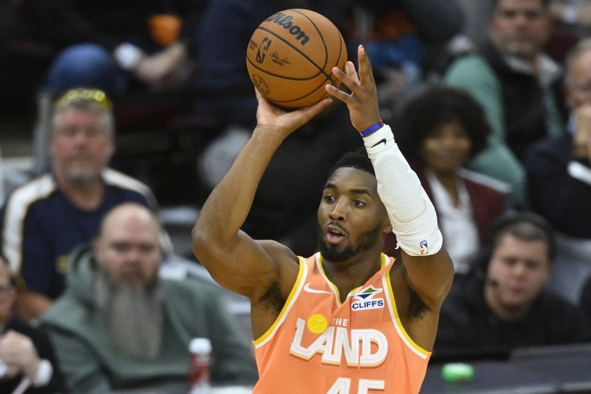 Nov 17, 2025; Cleveland, Ohio, USA; Cleveland Cavaliers guard Donovan Mitchell (45) shoots in the third quarter against the Milwaukee Bucks at Rocket Arena. Mandatory Credit: David Richard-Imagn Images