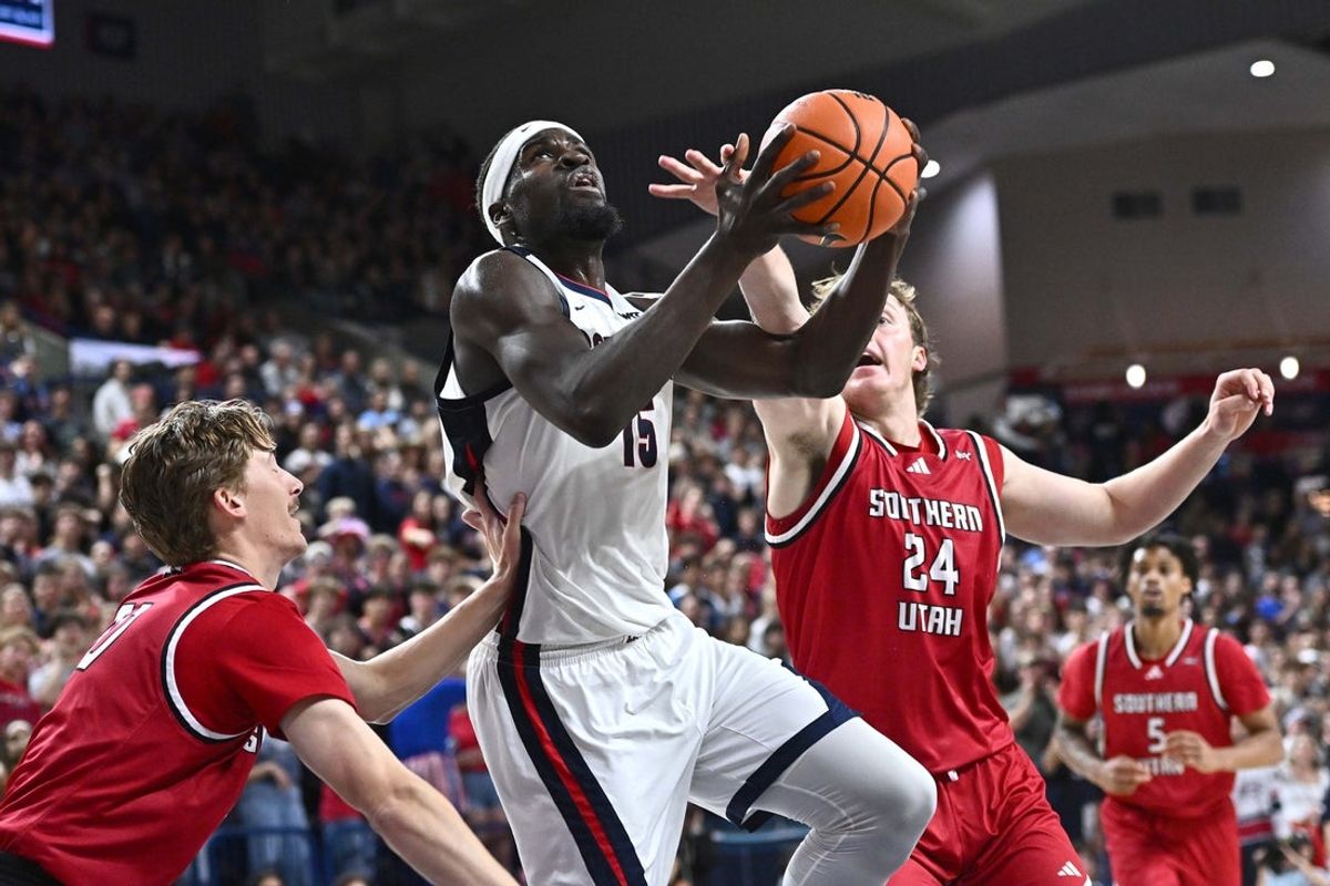 Nov 17, 2025; Spokane, Washington, USA; Gonzaga Bulldogs forward Graham Ike (15) shoots the ball against Southern Utah Thunderbirds forward Cale Barclay (24) in the first half at McCarthey Athletic Center. Mandatory Credit: James Snook-Imagn Images