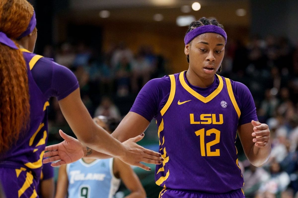 Nov 17, 2025; New Orleans, Louisiana, USA; LSU Tigers guard Mikaylah Williams (12) reacts after a free throw with LSU Tigers guard Zakiyah Johnson (11) against the Tulane Green Wave during the second half at Avron B. Fogelman Arena in Devlin Fieldhouse. Mandatory Credit: Matthew Hinton-Imagn Images