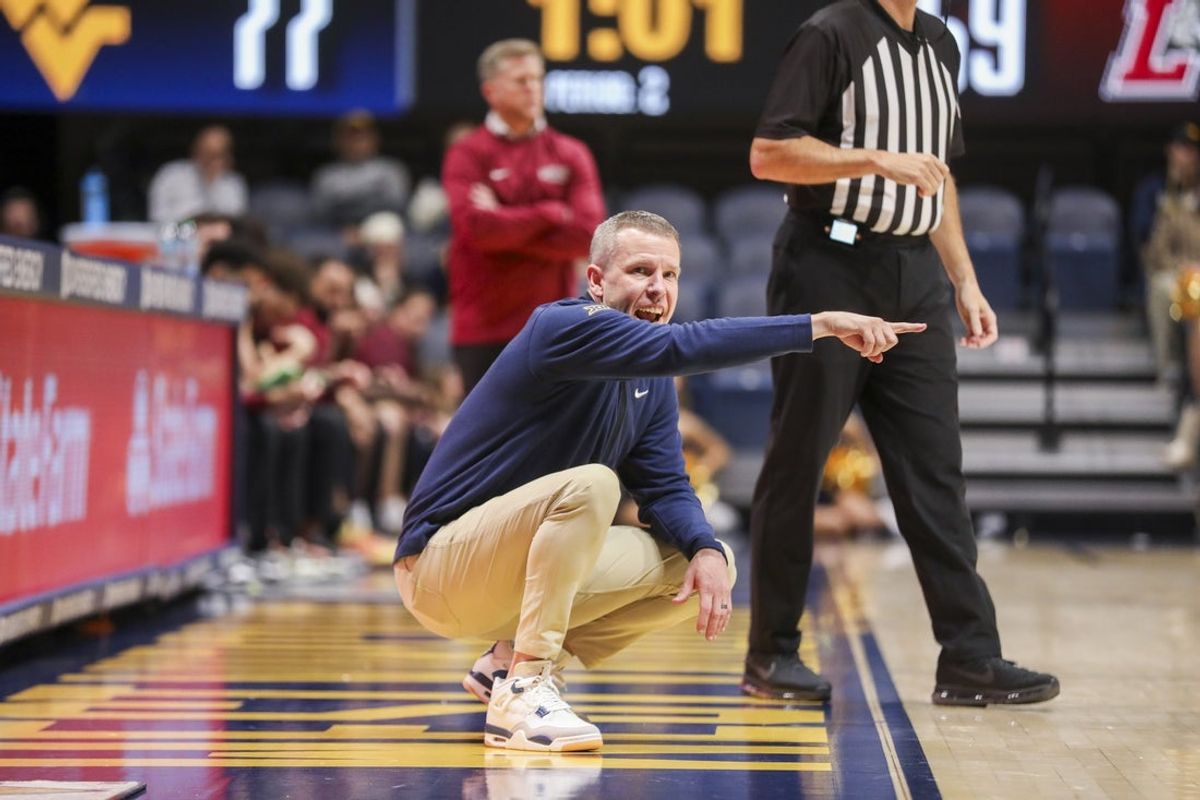 Nov 17, 2025; Morgantown, West Virginia, USA; West Virginia Mountaineers head coach Ross Hodge yells from the sideline during the second half against the Lafayette Leopards at WVU Coliseum. Mandatory Credit: Ben Queen-Imagn Images