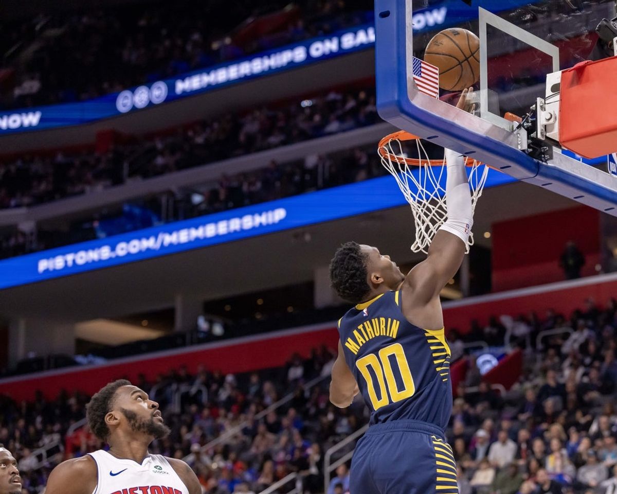 Nov 17, 2025; Detroit, Michigan, USA; Indiana Pacers guard Bennedict Mathurin (00) drives to the basket for two points against the Detroit Pistons during the second half at Little Caesars Arena. Mandatory Credit: David Reginek-Imagn Images