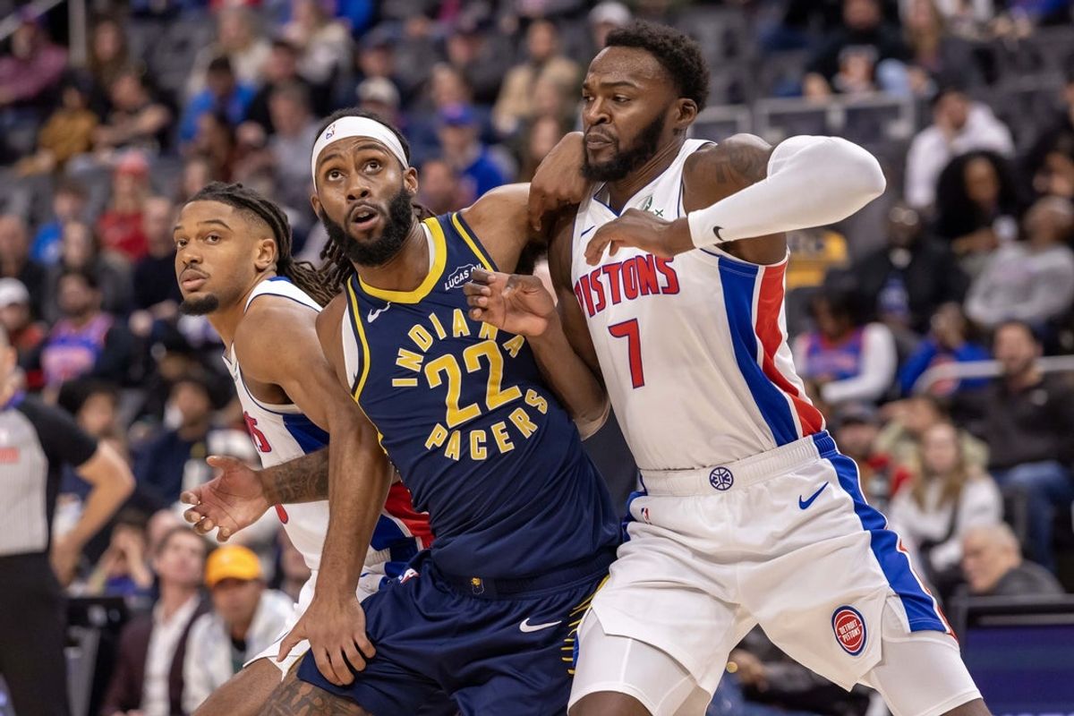 Nov 17, 2025; Detroit, Michigan, USA; Detroit Pistons forward Paul Reed (7) battles for position with Indiana Pacers forward Isaiah Jackson (22) during the second half at Little Caesars Arena. Mandatory Credit: David Reginek-Imagn Images