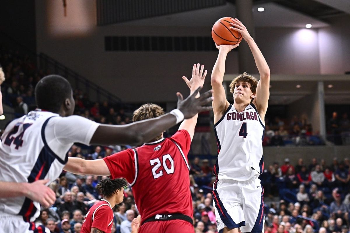 Nov 17, 2025; Spokane, Washington, USA; Gonzaga Bulldogs guard Davis Fogle (4) shoots the ball against Southern Utah Thunderbirds guard Dylan Jones (20) in the second half at McCarthey Athletic Center. Mandatory Credit: James Snook-Imagn Images