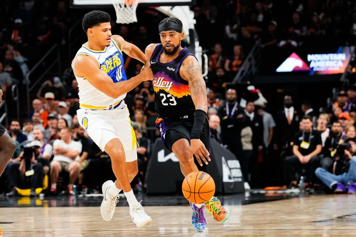 Nov 13, 2025; Phoenix, Arizona, USA;  Indiana Pacers guard RayJ Dennis (10) grabs Phoenix Suns guard Jordan Goodwin (23)’s jersey during the second half of the game at Mortgage Matchup Center. Mandatory Credit: Arianna Grainey-Imagn Images
