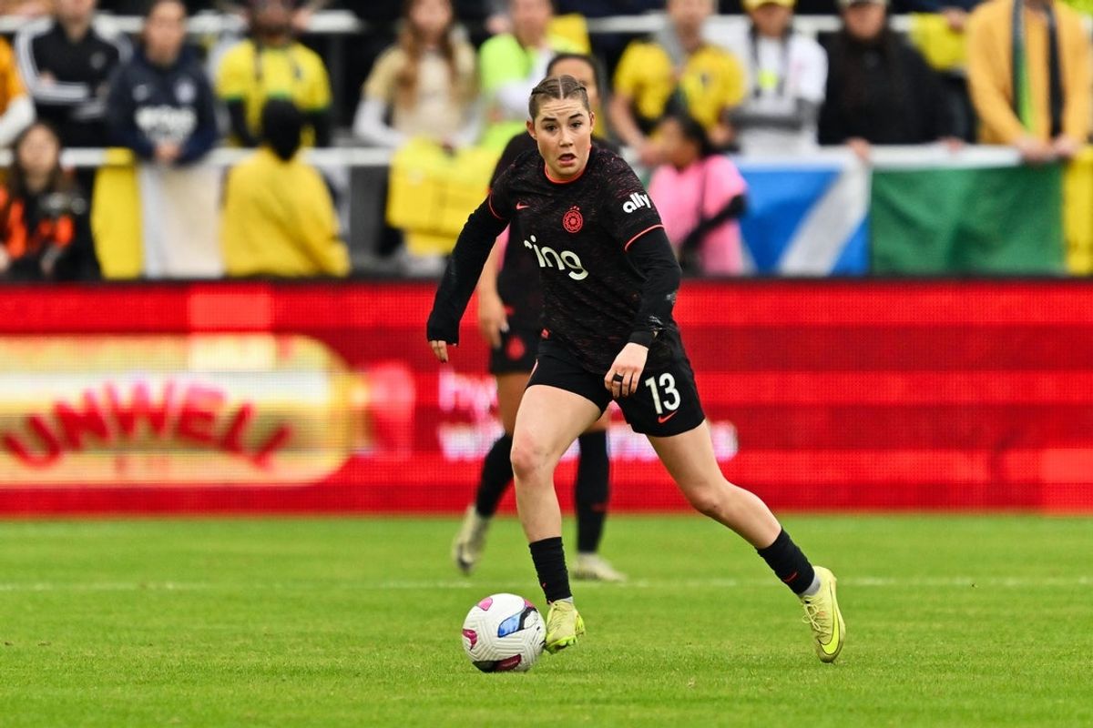 Nov 15, 2025; Washington, District of Columbia, USA;  Portland Thorns midfielder Olivia Moultrie (13) controls the ball against the Washington Spirit at Audi Field. Mandatory Credit: Jamie Sabau-Imagn Images