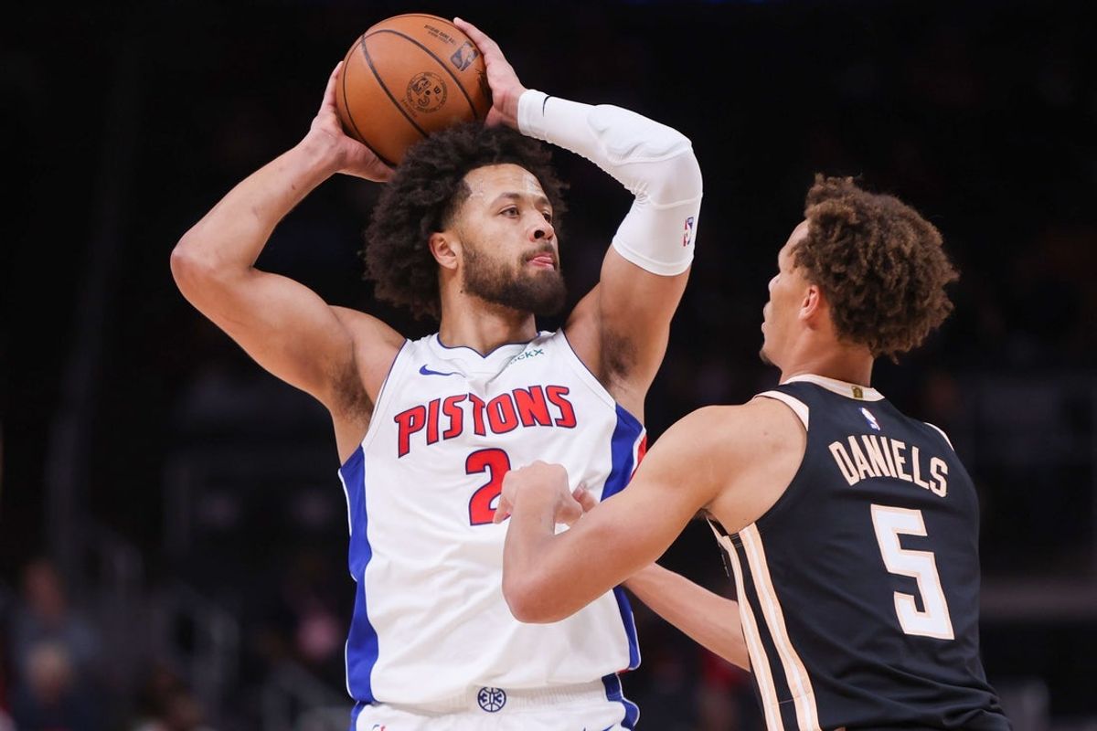Nov 18, 2025; Atlanta, Georgia, USA; Detroit Pistons guard Cade Cunningham (2) is defended by Atlanta Hawks guard Dyson Daniels (5) in the first quarter at State Farm Arena. Mandatory Credit: Brett Davis-Imagn Images