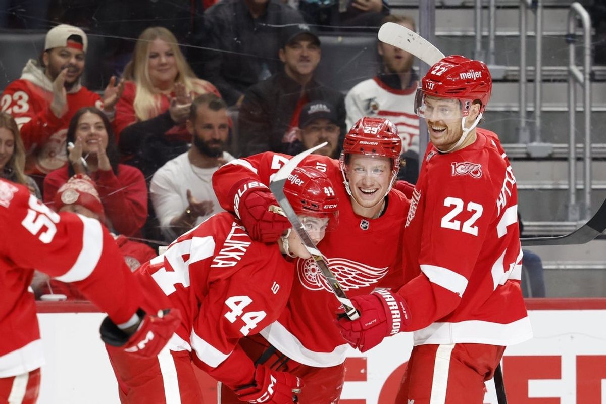 Nov 18, 2025; Detroit, Michigan, USA; Detroit Red Wings center Nate Danielson (29) receives congratulations from defenseman Axel Sandin-Pellikka (44) and center Mason Appleton (22) after scoring in the second period against the Seattle Kraken at Little Caesars Arena. Mandatory Credit: Rick Osentoski-Imagn Images