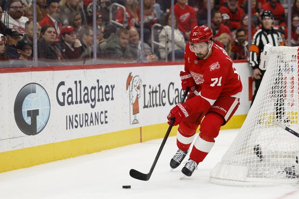 Nov 18, 2025; Detroit, Michigan, USA; Detroit Red Wings center Dylan Larkin (71) skates with the puck in the second period against the Seattle Kraken at Little Caesars Arena. Mandatory Credit: Rick Osentoski-Imagn Images