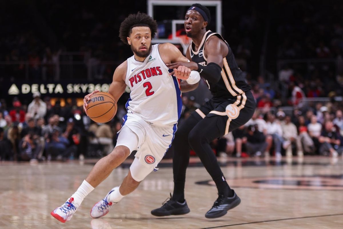 Nov 18, 2025; Atlanta, Georgia, USA; Detroit Pistons guard Cade Cunningham (2) drives on Atlanta Hawks forward Onyeka Okongwu (17) in the second quarter at State Farm Arena. Mandatory Credit: Brett Davis-Imagn Images