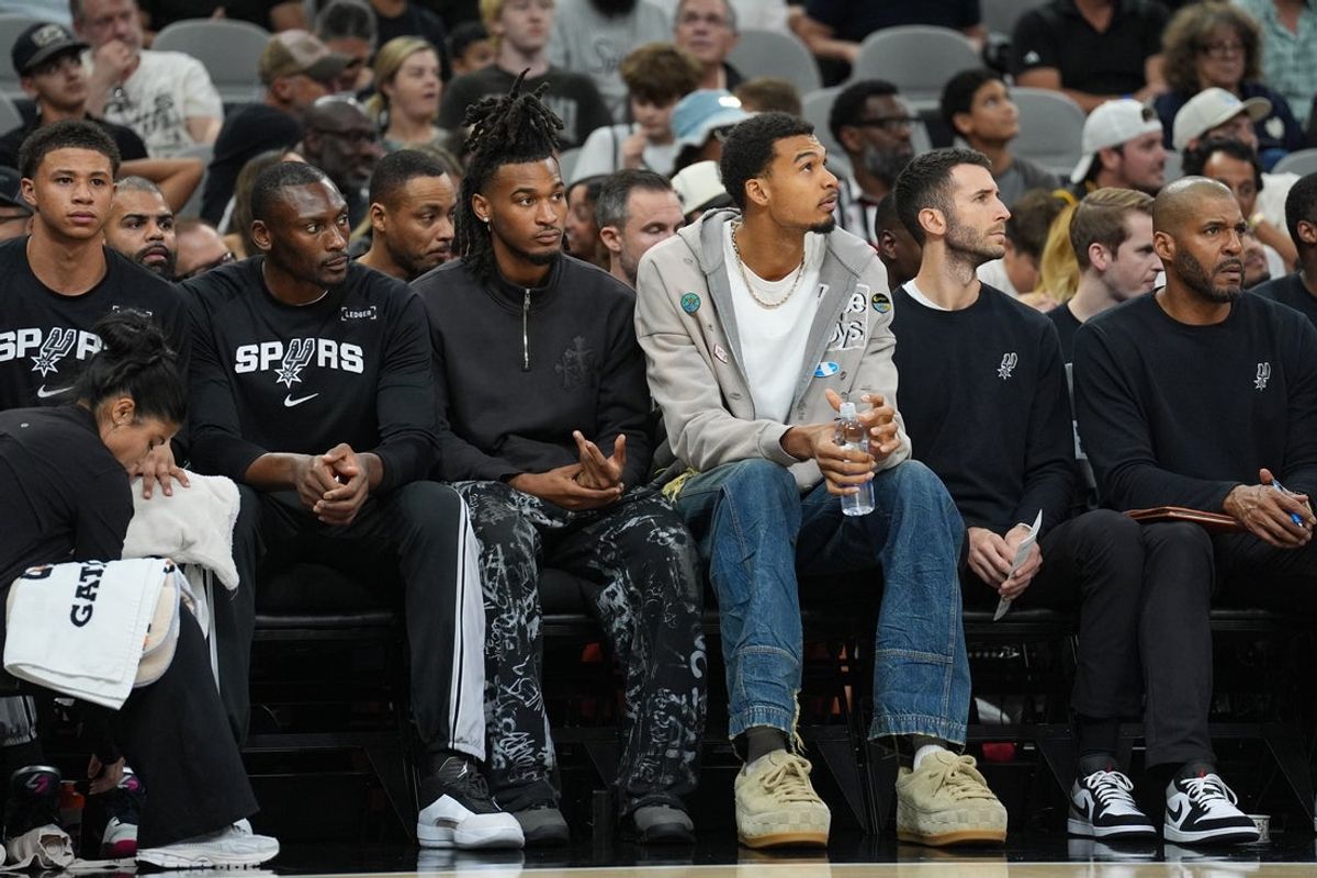 Nov 18, 2025; San Antonio, Texas, USA;  San Antonio Spurs guard Stephon Castle and forward Victor Wembanyama on the bench during the first half against the Memphis Grizzlies at Frost Bank Center. Mandatory Credit: Daniel Dunn-Imagn Images
