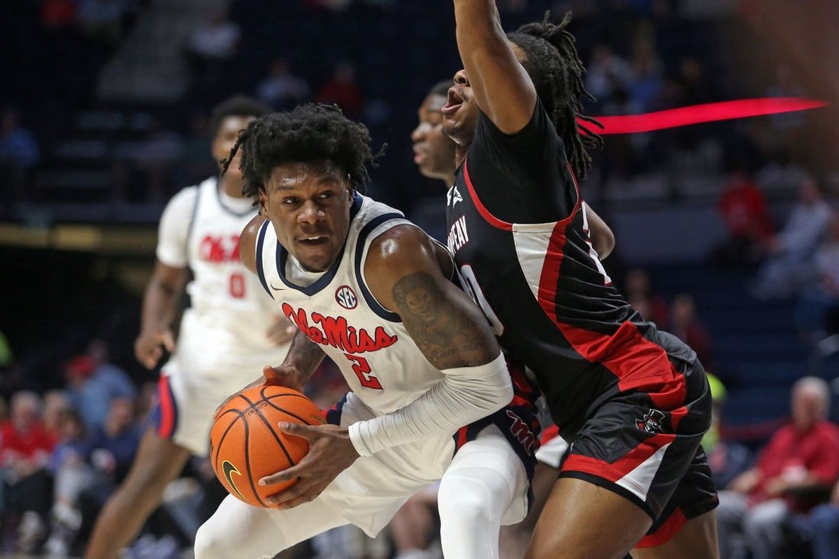 Nov 18, 2025; Oxford, Mississippi, USA; Mississippi Rebels guard AJ Storr (2) drives to the basket as Austin Peay Governors guard Quan Lax (20) defends during the first half at The Sandy and John Black Pavilion at Ole Miss. Mandatory Credit: Petre Thomas-Imagn Images