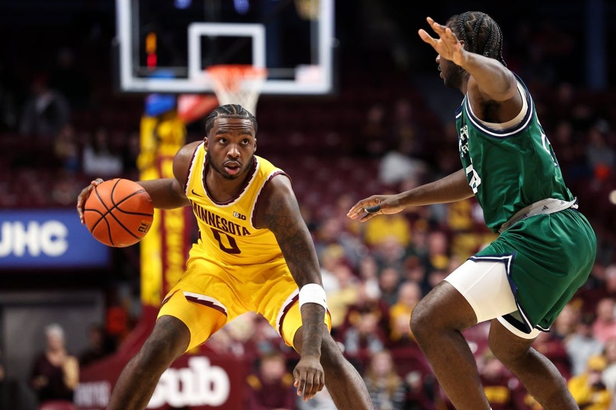 Nov 18, 2025; Minneapolis, Minnesota, USA; Minnesota Golden Gophers guard Chansey Willis Jr. (0) dribbles the ball as Chicago State Cougars guard Dakari Thomas (25) defends during the first half at Williams Arena. Mandatory Credit: Matt Krohn-Imagn Images