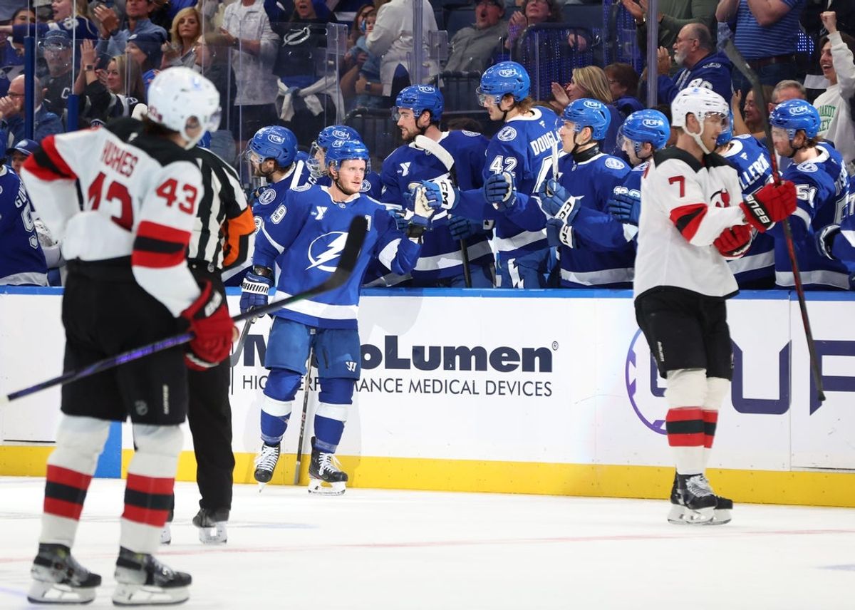 Nov 18, 2025; Tampa, Florida, USA;Tampa Bay Lightning center Jake Guentzel (59) is congratulated  after he scored a foal against the New Jersey Devils during the second period at Benchmark International Arena. Mandatory Credit: Kim Klement Neitzel-Imagn Images