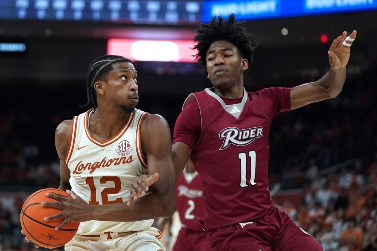 Nov 18, 2025; Austin, Texas, USA; Texas Longhorns guard Tramon Mark (12) moves to the basket against Rider Broncs guard Flash Burton (11) during the first half at Moody Center. Mandatory Credit: Dustin Safranek-Imagn Images