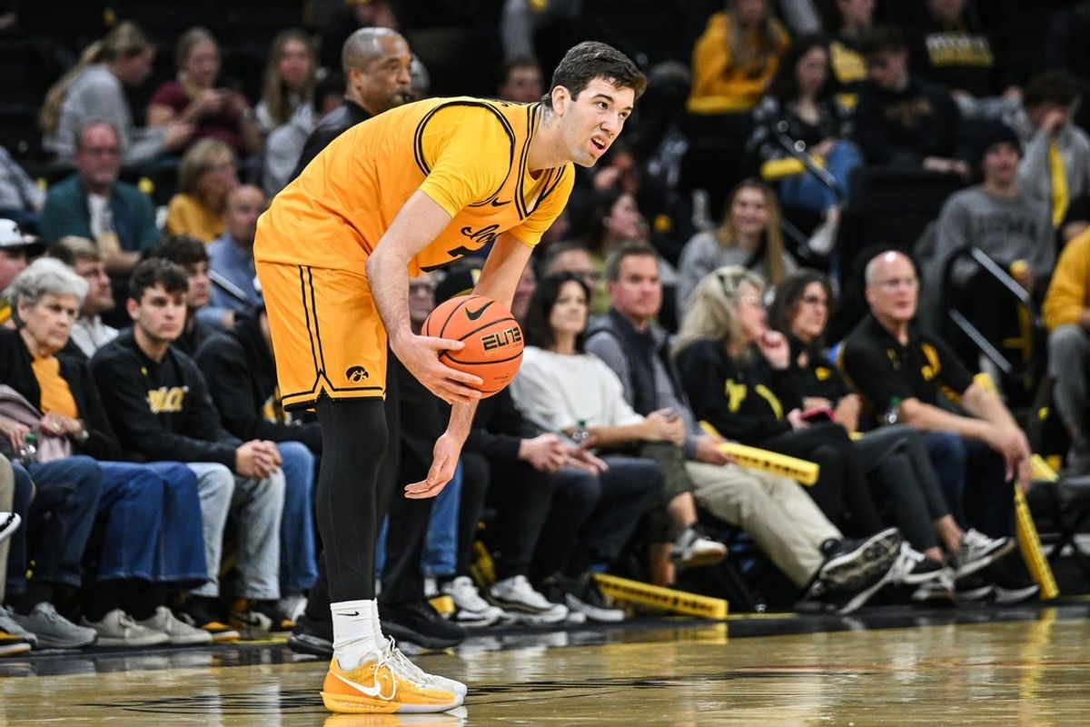 Nov 18, 2025; Iowa City, Iowa, USA; Iowa Hawkeyes forward Alvaro Folgueiras (7) controls the ball against the Southeast Missouri State Redhawks during the first half at Carver-Hawkeye Arena. Mandatory Credit: Jeffrey Becker-Imagn Images