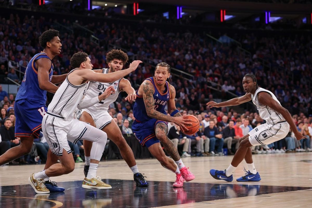 Nov 18, 2025; New York, New York, USA; Kansas Jayhawks guard Tre White (3) goes to the basket during the first half against the Duke Blue Devils at Madison Square Garden. Mandatory Credit: Vincent Carchietta-Imagn Images